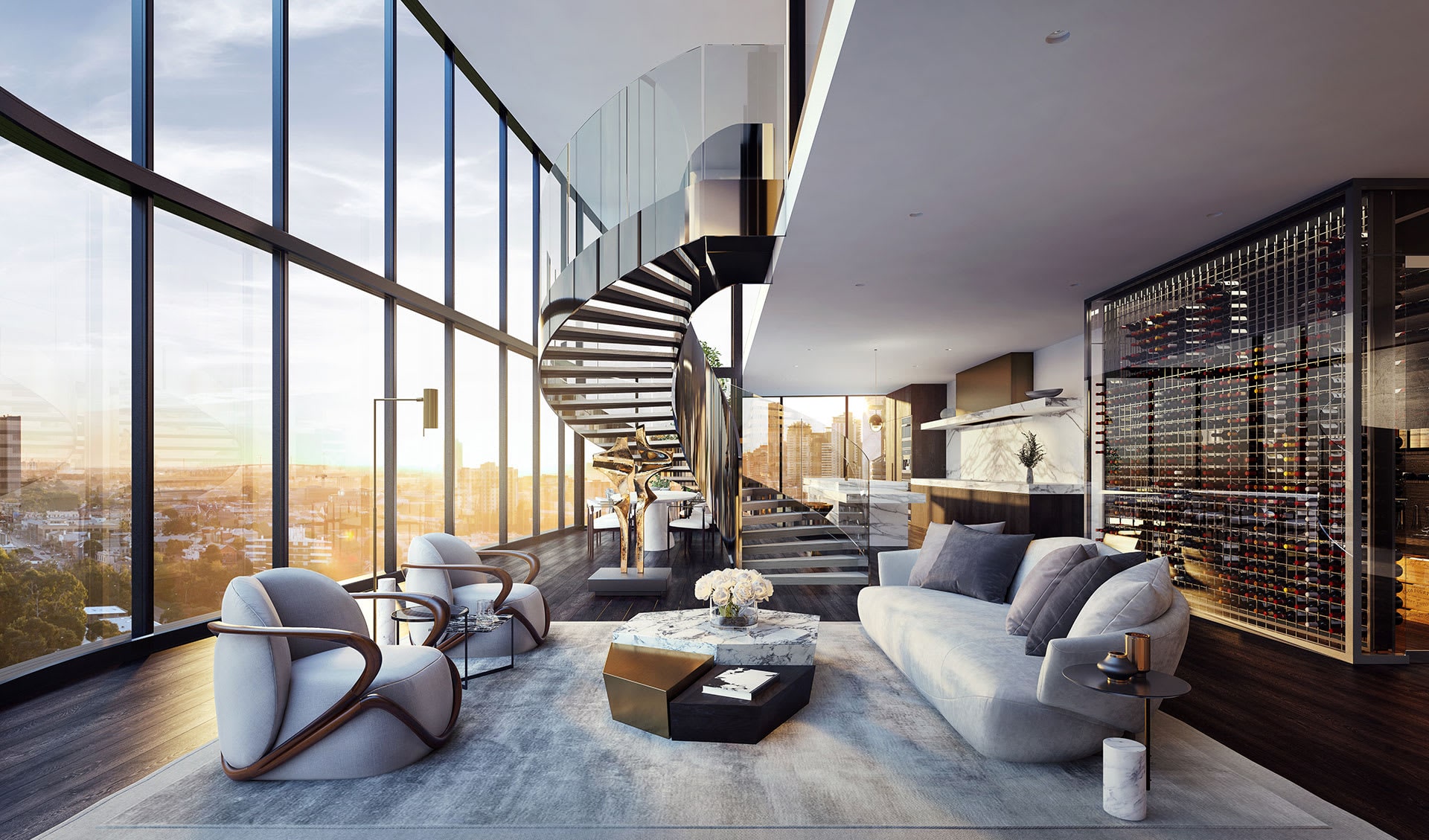 Phòng khách căn hộ Penthouse tại Sun Feliza Suites Xuân Thủy với trần cao hai tầng, tường kính toàn cảnh, cầu thang xoắn ốc kính, nội thất cao cấp gồm sofa cong, bàn đá cẩm thạch, ghế bọc vải sang trọng, bếp mở ốp đá tự nhiên và tủ rượu âm tường quy mô lớn. Ánh sáng hoàng hôn chiếu vào làm nổi bật không gian đẳng cấp.