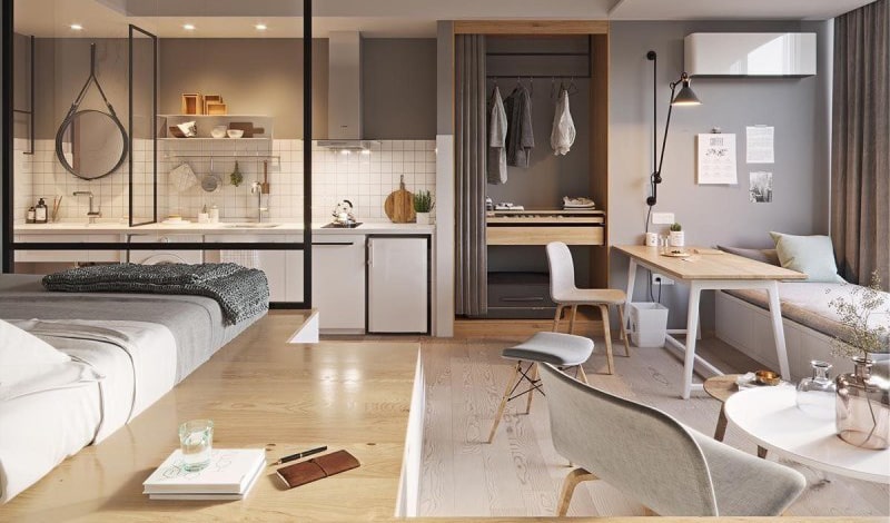 Sun Feliza Suites 7 Không gian nội thất căn hộ studio hiện đại tại dự án Sun Feliza Suites Xuân Thủy, bố trí mở gồm bếp, giường ngủ, bàn làm việc và tủ quần áo, tông màu xám – gỗ sáng mang lại cảm giác ấm cúng và tiện nghi.